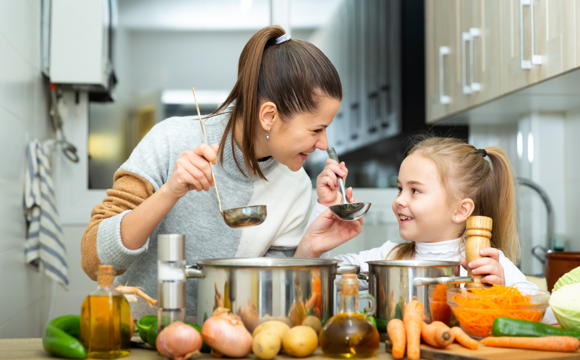 woman and daughter making soup